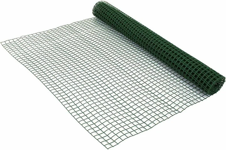 1M x 5M green plastic mesh fencing rolled up against a white surface